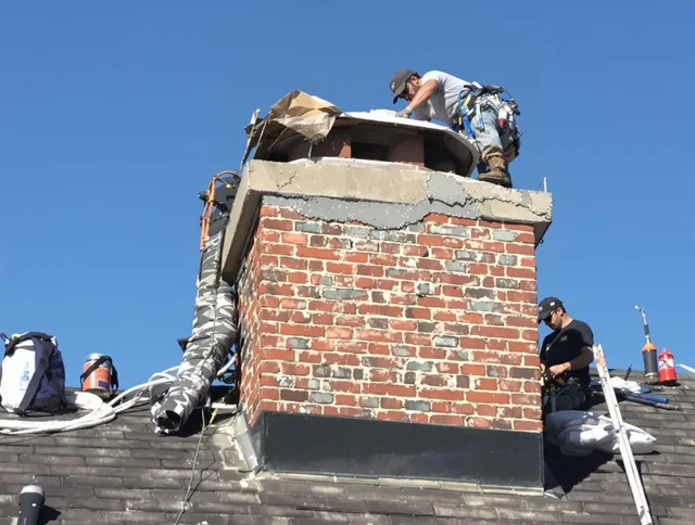 Bexley Chimney Sweep installing a custom chimney crown in Bexley, OH
